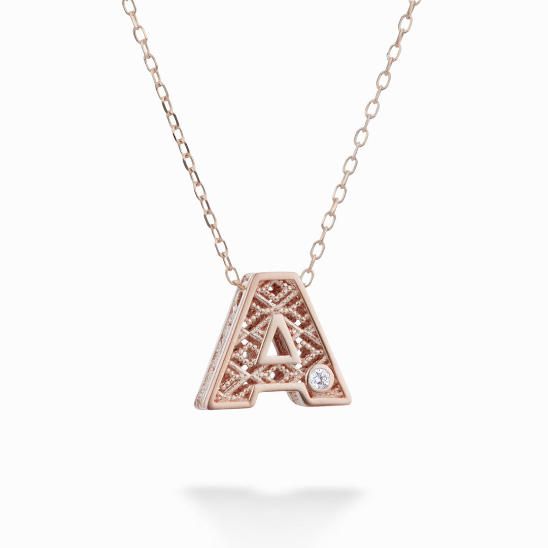 Lettre Nihama cl en or rose 18 carats diam. ct.0,01 NDLETAO3