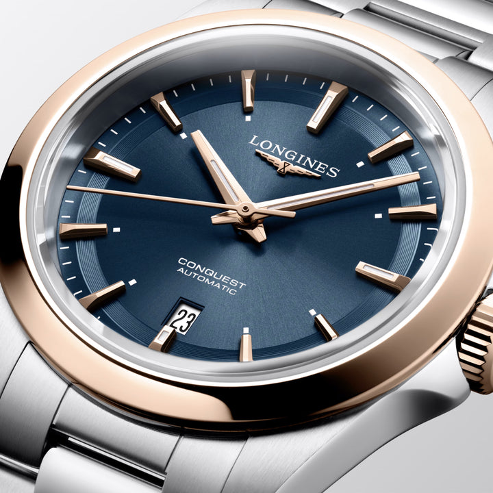 Montre Longines Conquest 30mm bleu automatique acier finition PVD or rose L3.320.5.92.6